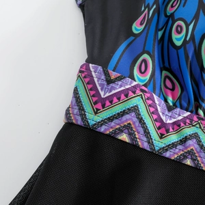 Detail of swimsuit with peacock feather print, geometric belt, and black mesh fabric