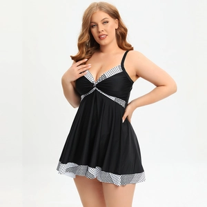 Detail view of plus size black one-piece swim dress with V-neck and polka dot patterns