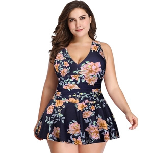 Detail of plus size modest swimwear featuring floral print skirt and deep V-neckline