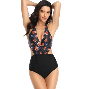 Detail of v-neck one-piece swimsuit with floral print and stylish side cutouts