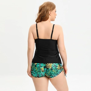 Back view of plus size black tankini set with tropical leaf print swim shorts