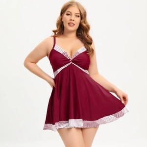 Detail of burgundy plus size swimwear with white polka dots and front knot design