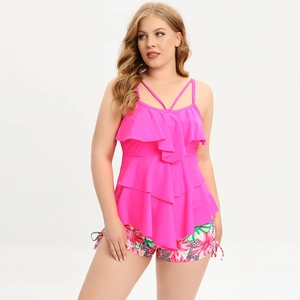 Detail of plus size tankini with layered ruffles and tropical floral print bottoms