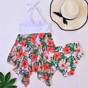 Detail of white and tropical floral print tankini set with mesh skirt and halter top