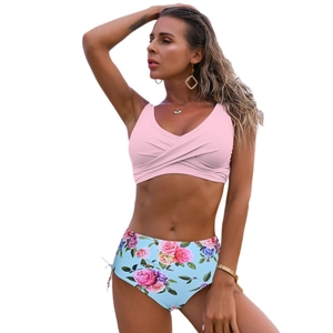 Sexy two-piece bikini set with pink twist front top and floral high waist bottom