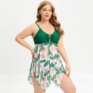 Plus size two-piece swimsuit with dark green top and tropical floral print mesh skirt