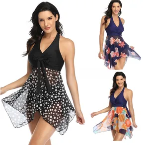 Detailed views of three plus-size swimsuits featuring mesh skirts and lace-up V-necks