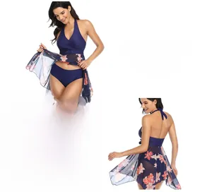 Detail of navy blue halter bikini set with pink floral mesh cover-up skirt for women