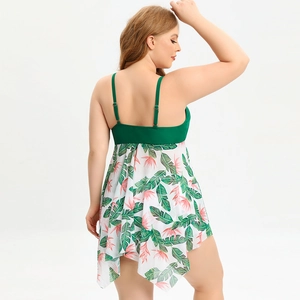 Detail of plus size high waist swimdress featuring tropical leaf print and mesh skirt