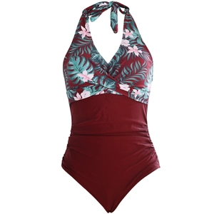 Detail of floral wrap halter neck one piece swimsuit with wine red ruched waist design