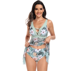 Detail of tropical floral print tankini with mesh skirt and V-neck crossover straps