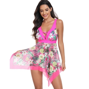 Detail of rose pink swim dress with tropical print, deep V-neck and mesh skirt