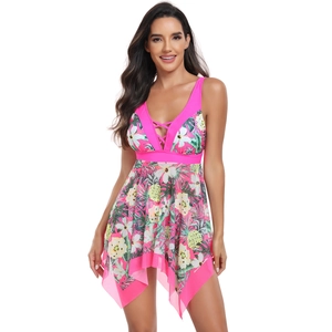 Detail of pink V-neck swimsuit dress featuring tropical floral prints and asymmetrical hem