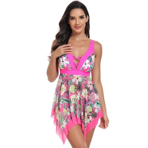 Detail of the deep V-neckline with criss-cross lace-up and tropical floral print on swimsuit