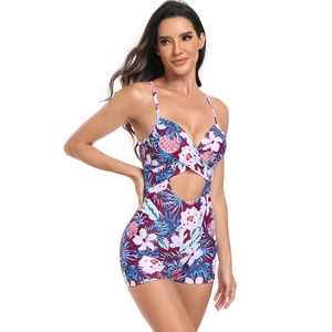 Detail of tropical pineapple floral print on cutout one-piece swimsuit with V-neckline