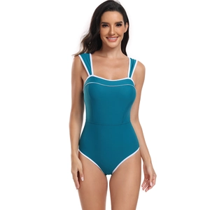Detail view of teal one-piece swimsuit featuring contrast white piping and wide shoulder straps