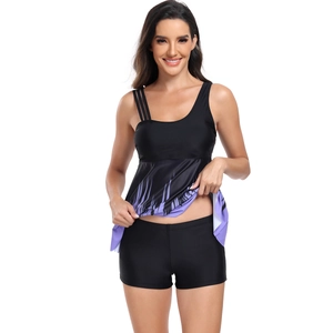 Detail of a two-piece tankini top with purple gradient stripes and side strappy design