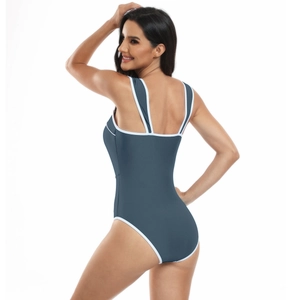 Detail view of the back and white contrast trim on a blue sporty one-piece swimsuit