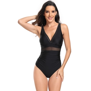Detail of black one-piece swimsuit featuring mesh paneling and flattering ruched waist