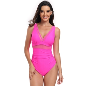 Detail of neon pink one-piece swimsuit with V-neckline and mesh patchwork design