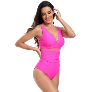 Detail of pink one-piece swimsuit with deep V-neck, mesh waist, and ruched tummy control