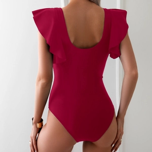 Detail view of burgundy one-piece swimsuit featuring ruffled sleeves and deep U-back design