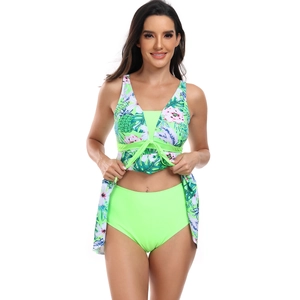Detail of tropical floral tankini top with cross-tie waist and high waist bottoms