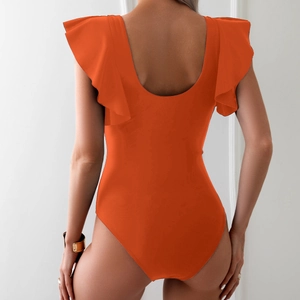Close-up of orange one-piece swimsuit with open back and double-layered ruffle straps