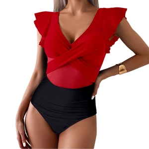 Detail view of red V-neck one-piece swimsuit with ruffled shoulders and high waist black bottom