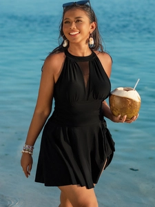 Detailed view of black plus size halter swim dress with mesh insert and pleated hem