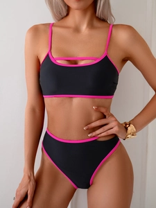 Detail of color-block bikini with hollow stripe top and high-cut pink trim bottoms
