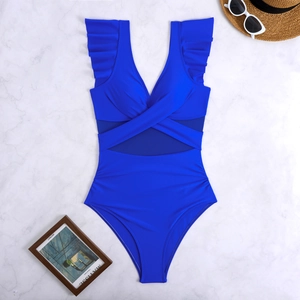 Detail of blue one-piece swimsuit with ruffle straps and mesh waist on marble surface