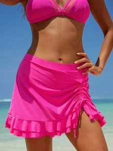 Detail of rose pink bikini skirt with adjustable drawstring side and ruffled hemline
