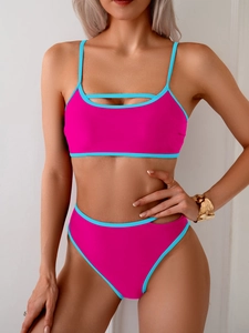 Detail of pink and blue bikini set showing cutout chest strap and high waist bottom