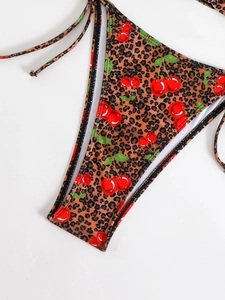 Detail of leopard and cherry print bikini bottom with adjustable side string ties