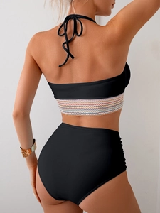 Rear view of a black bikini set with high-waisted bottoms and rainbow stripe band details