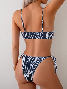 Rear view of zebra print bikini set featuring adjustable thin straps and side-tie bottoms