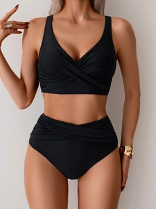 Detailed front view of black high-waisted bikini set with cross knot top and ruched waist