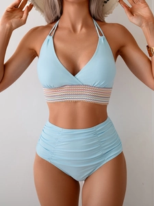 Detail of light blue halter bikini top with wavy textured elastic and high-waist side ruching