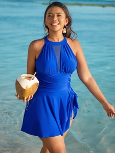 Detail of navy blue plus size swim dress with mesh neckline and ruched tummy control design