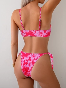 Rear view of pink tropical hibiscus print bikini set with lace-up side high cut bottom