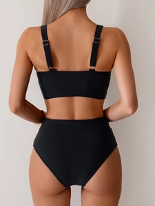 Detail view of adjustable wide straps and metallic buckle on back of black bikini top