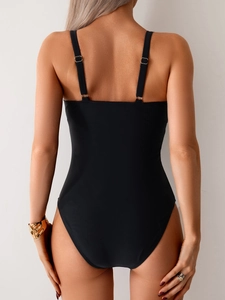 Detail of black one-piece swimsuit featuring adjustable thin double shoulder straps