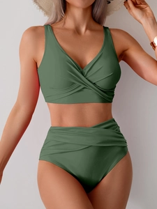 Detail of olive green two-piece bikini featuring wrap top and high-waisted pleated bottoms