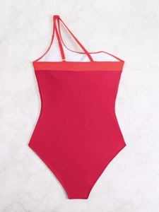 Detailed flat lay of rose red one-shoulder swimsuit on marble texture background