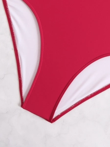 Macro detail of red high-elastic swimwear fabric with smooth white lining and fine stitching