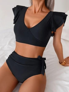 Macro shot of black deep V-neck bikini top with layered ruffles and high waist bottoms