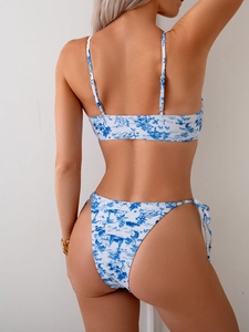 Detail of blue Toile de Jouy print on tie-side bikini bottom and high-cut back fit