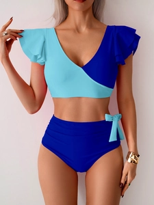 Detail of high waist bikini bottom with sky blue bow and contrast stitching design