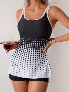 Close-up of a black and white polka dot tankini with boyshort bottoms for women